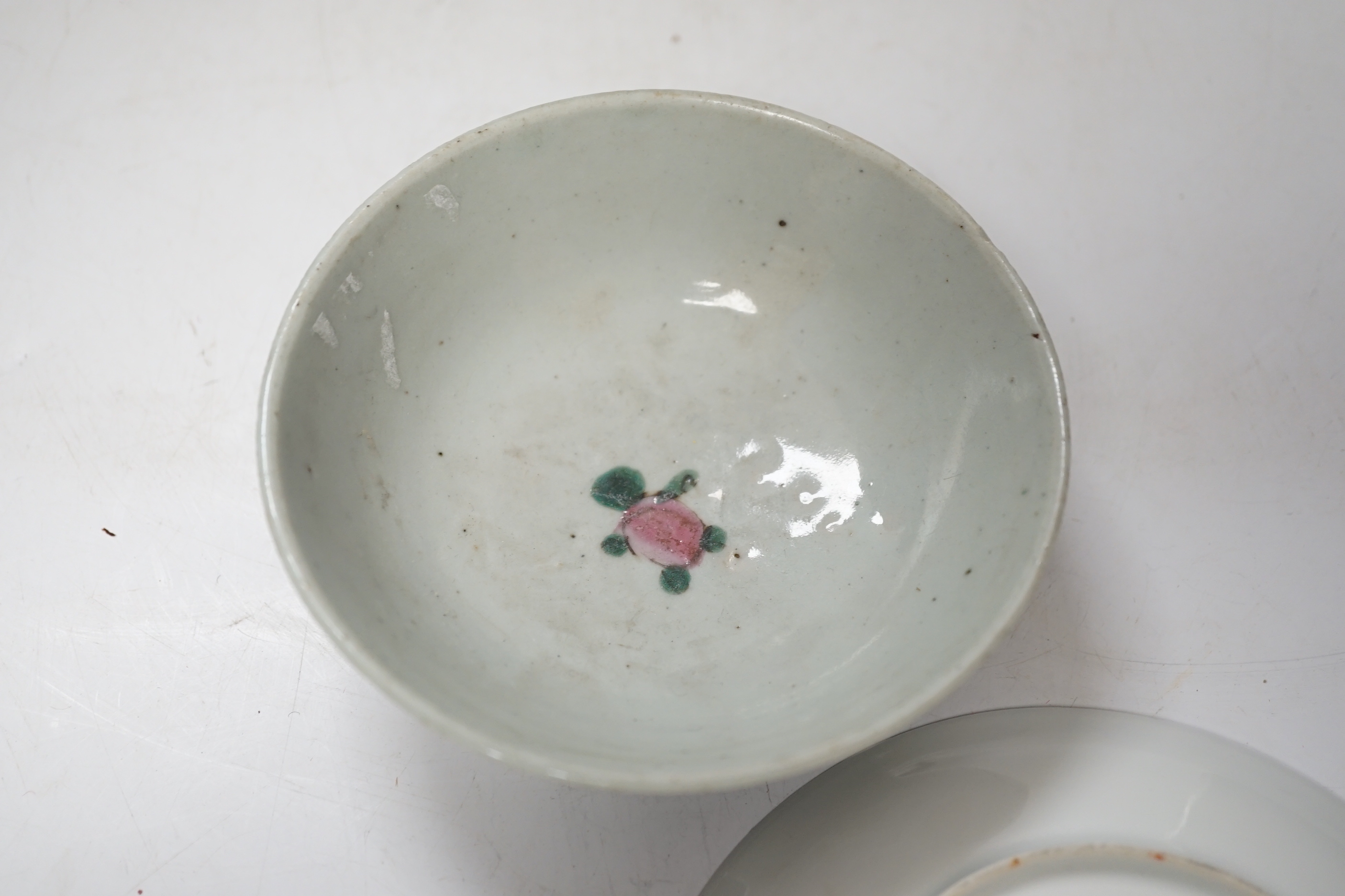 A Chinese famille rose vase, a rice dish, saucer and wooden stands